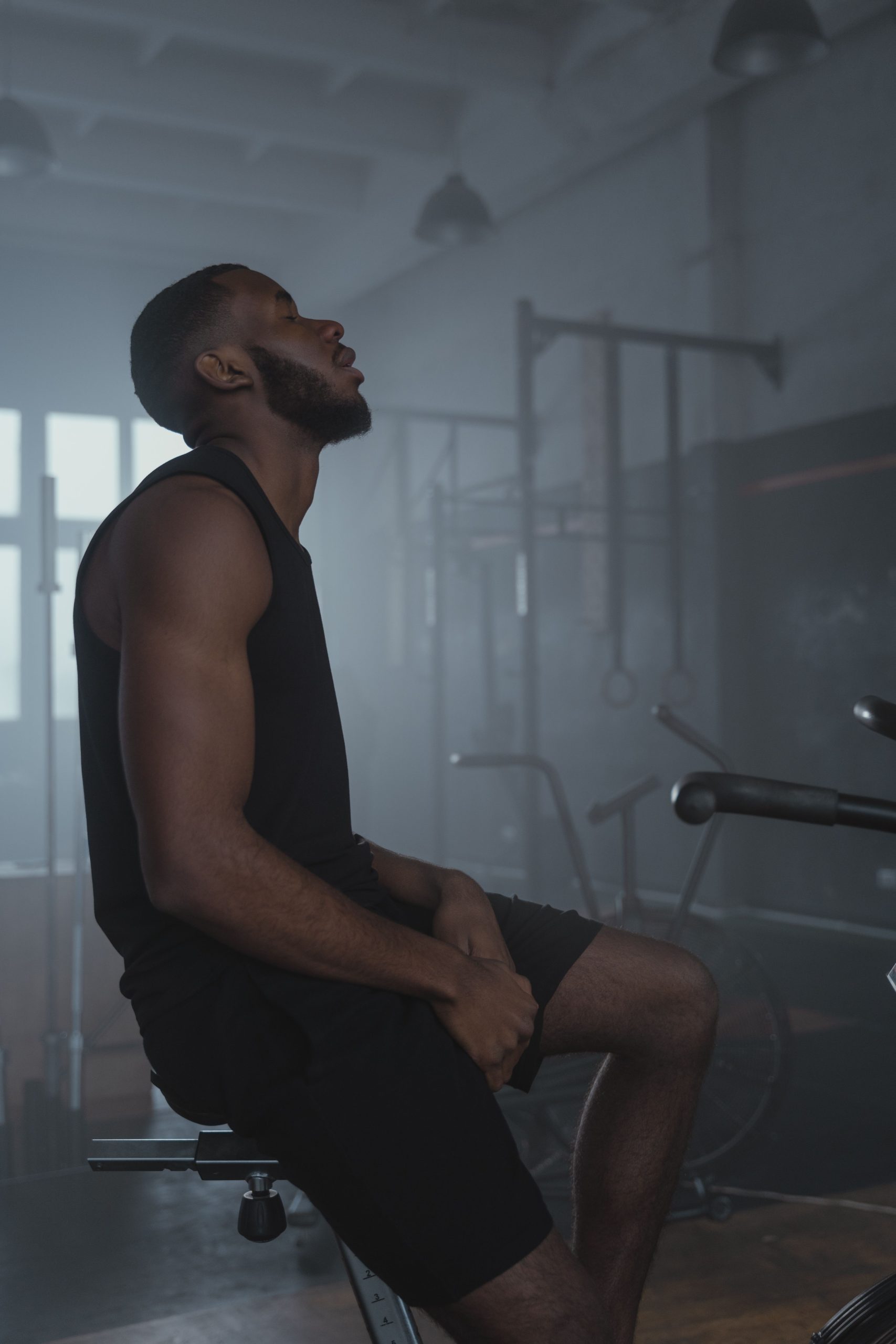 Athlete resting in a gym after training
